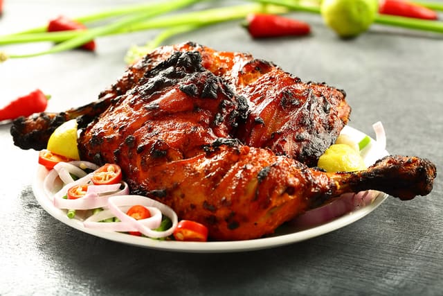Tandoori Chicken (Dark Meat Only) Half 13.95 or Full 21.95